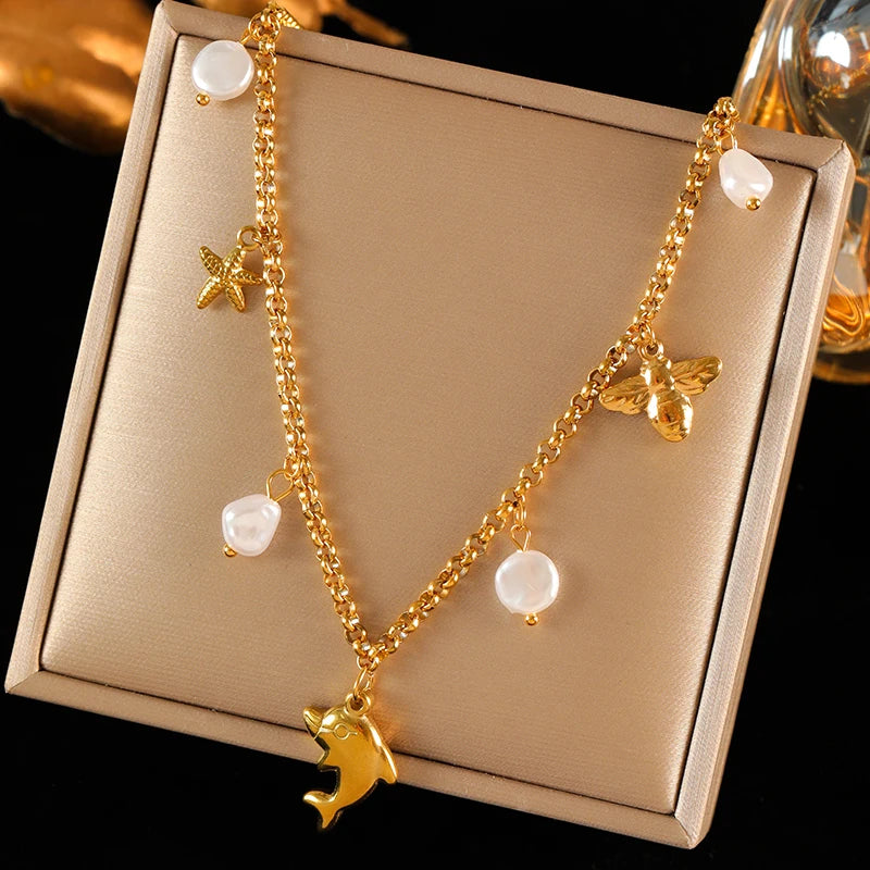 collier dauphin jaune doré